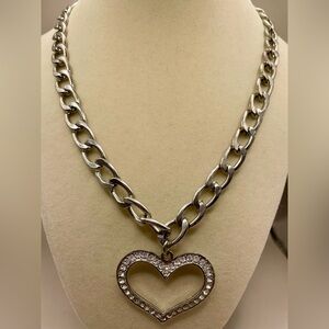 Rhinestone heart pendant on a silver tone chain link necklace. Chunky.